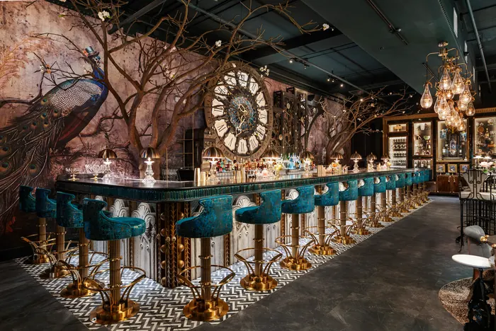 The full length of the bar, mosaic clock centred above the back bar